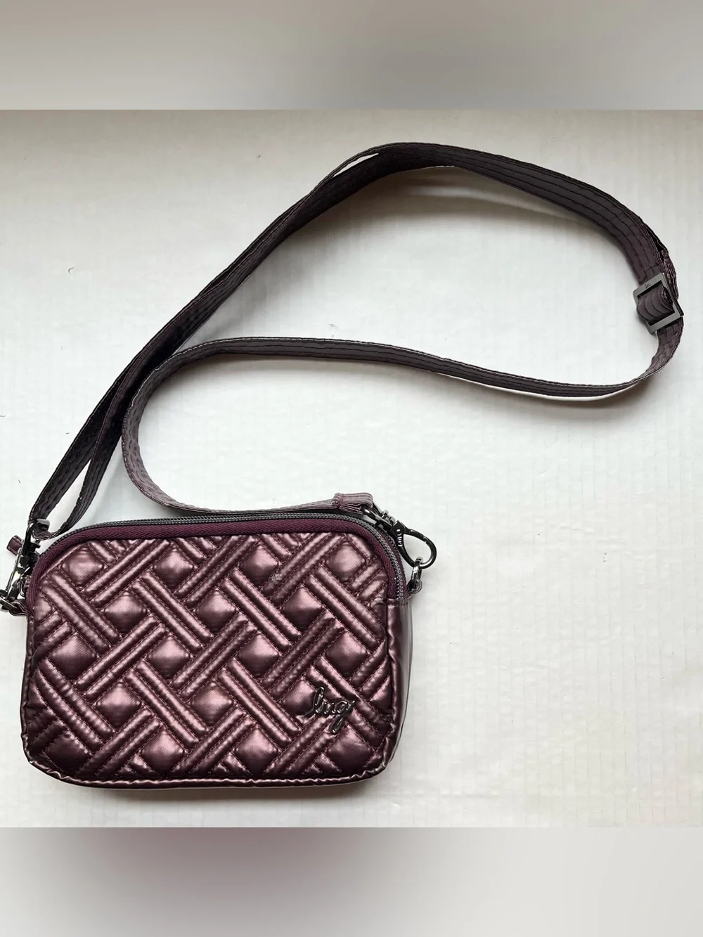 Lug Coupe Convertible Crossbody Bag with Basketweave Pattern in Purple/Plum.